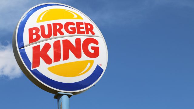 Burger King sign against blue sky