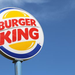Burger King sign against blue sky