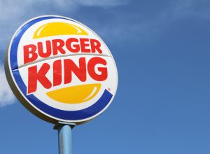 Burger King sign against blue sky