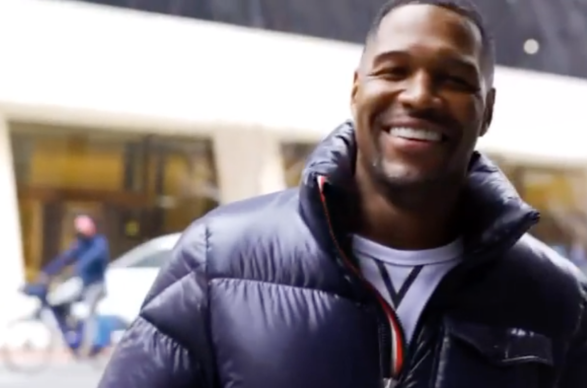 Michael Strahan smiling outside after the procedure