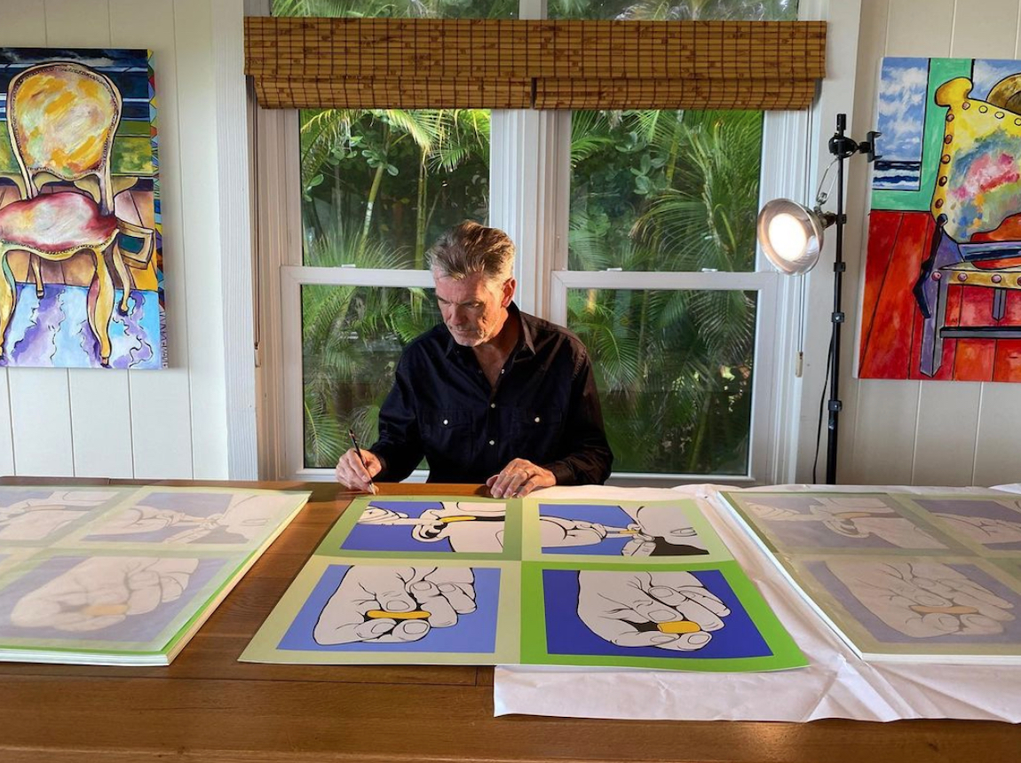 Pierce Brosnan working on art