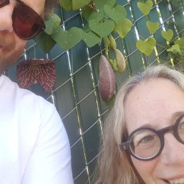 Seth Rogen and his mom Sandy Rogen pose for a selfie against a fence
