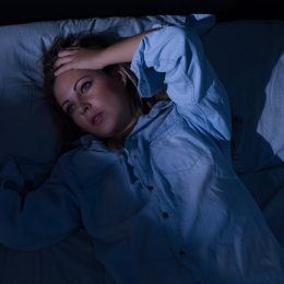 Young woman awake at night