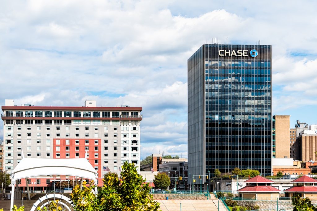 Charleston, USA - October 17, 2019: West Virginia capital city cityscape skyline with Chase bank and logo on building and cloudy sky