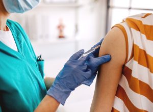Doctor vaccinates patient