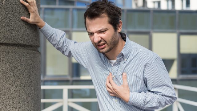 Man feeling a big pain in the chest