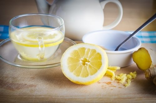 Hote lemon water in clear mug on table