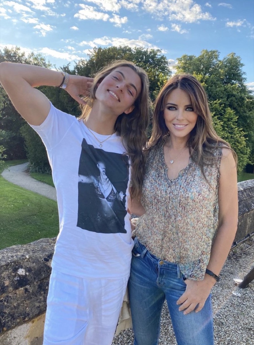 elizabeth hurley and son damian hurley standing together outdoors