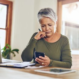 Woman looking at bills