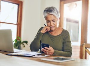 Woman looking at bills