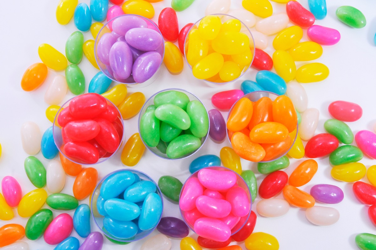 bright colored jelly beans in small plastic containers