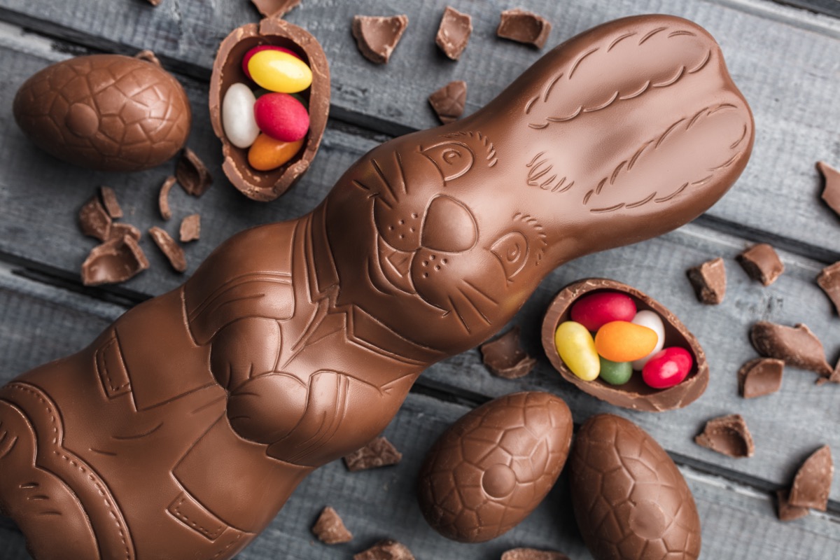 chocolate easter bunny next to jelly beans