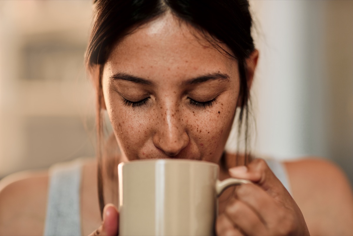 Woman drinking coffee out of a mug