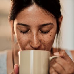 Woman drinking coffee out of a mug
