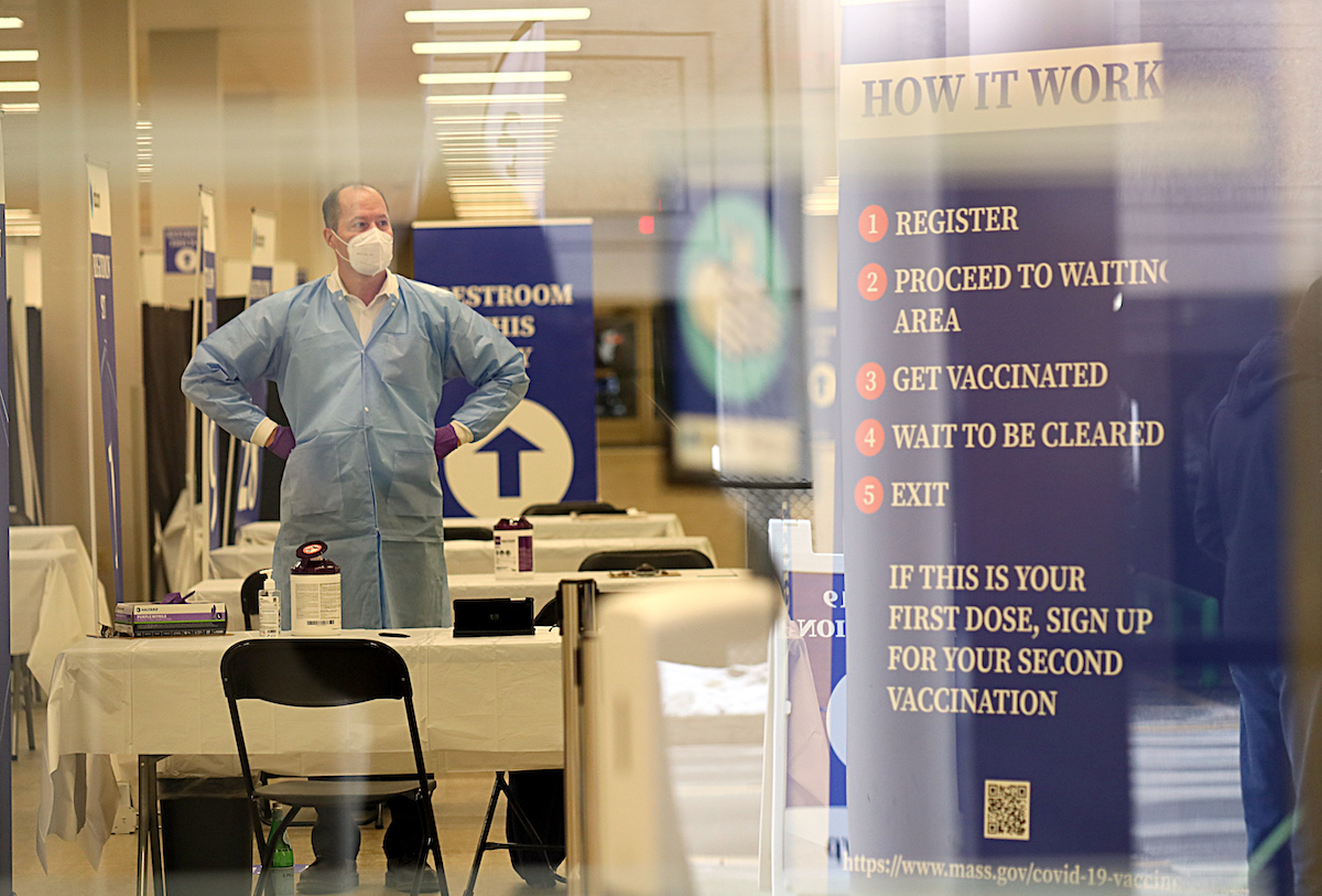 The scene through a window into the mass vaccination site at the Natick Mall in Natick, MA on Feb. 22, 2021. Labcorp has a COVID-19 vaccination site by appointment only at the Natick Mall.