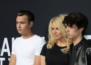 Brandon Lee, Pamela Anderson, and Dylan Lee at a Saint Laurent fashion show in Hollywood in 2016