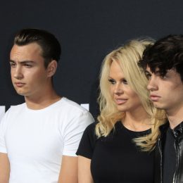 Brandon Lee, Pamela Anderson, and Dylan Lee at a Saint Laurent fashion show in Hollywood in 2016