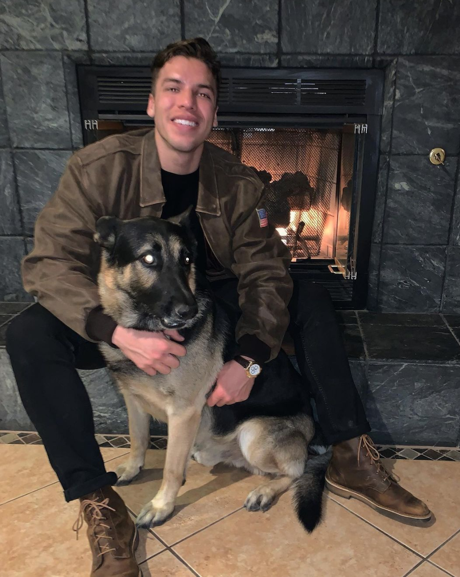 Joseph Baena posing with a dog in an Instagram picture
