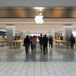 apple store exterior in mall with customers walking in