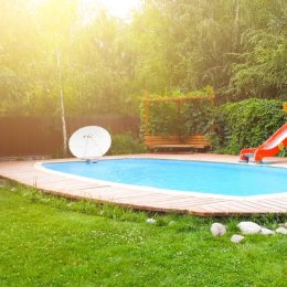 backyard with pool and red slide