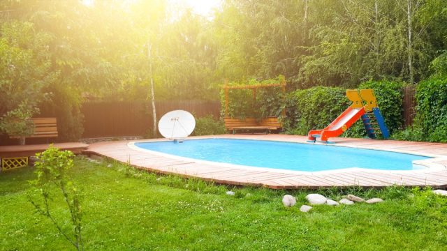 backyard with pool and red slide