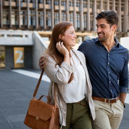 A heterosexual couple walking down the street