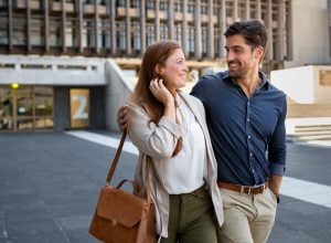 A heterosexual couple walking down the street