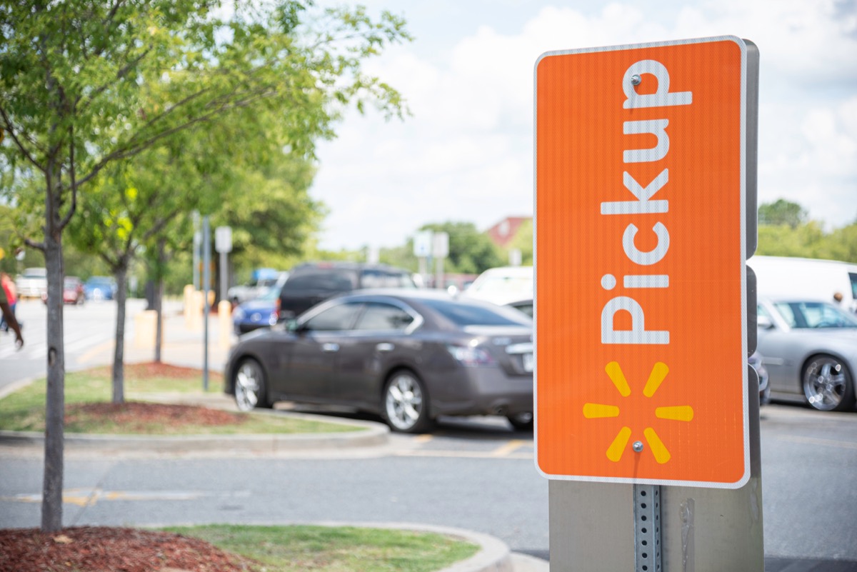 Vidalia, Georgia / USA - May 28, 2019: The reserved spots for Walmart's new Pickup service are marked with prominent orange signs.