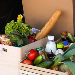 crates of produce and fresh food in the back of a truck