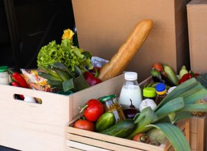 crates of produce and fresh food in the back of a truck
