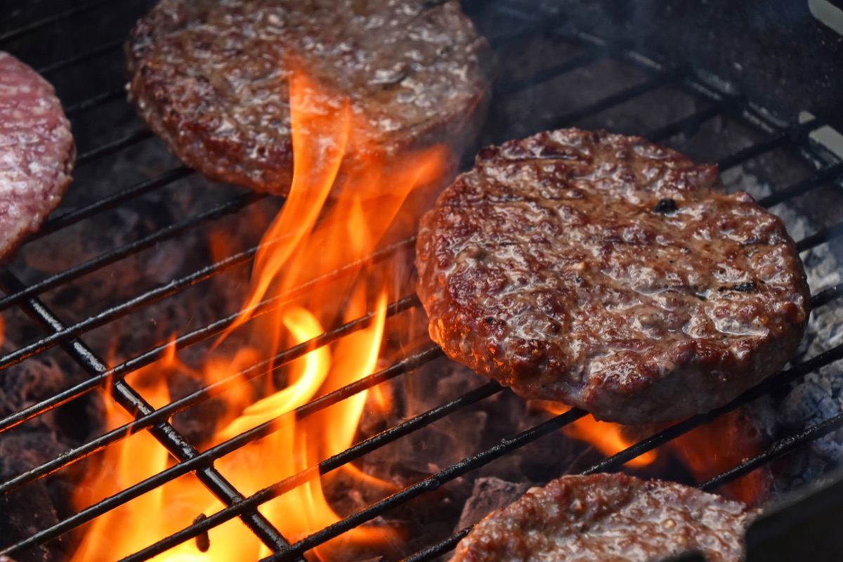 beef or port burgers on grill, fire, juicy burgers