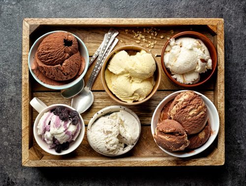 bowls of ice cream on wooden tray