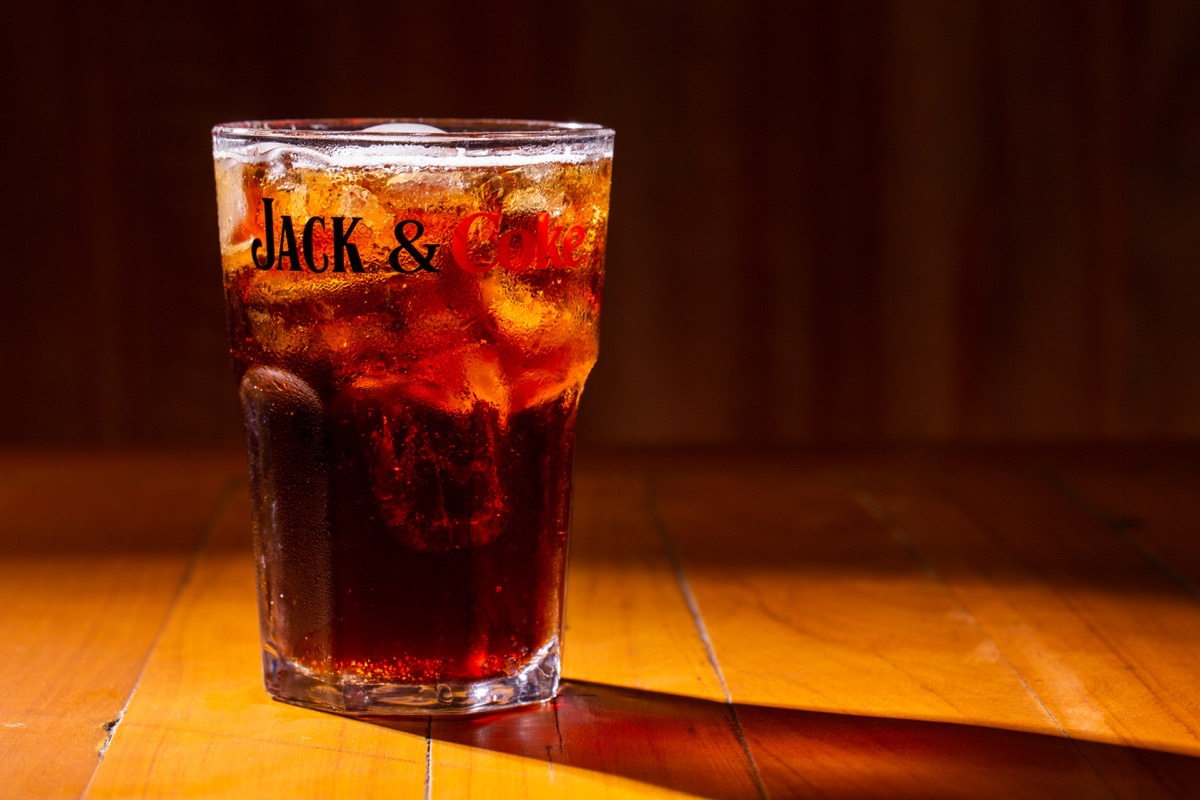 jack and coke, cocktail in class on table