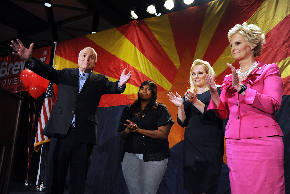 Sen. John McCain (R-AZ) (L) speaks to the crowd with his wife Cindy McCain (R) and daughters Meghan McCain (2R) and Bridget McCain during an Arizona Republican Party election night event at the Hyatt Regency November 2, 2010 in Phoenix, Arizona