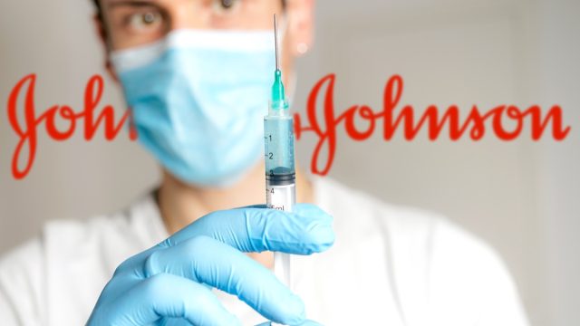 doctor holds johnson & johnson vaccine