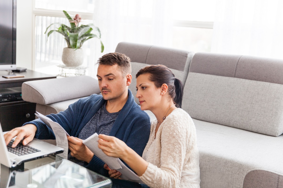 couple at home, applying for credit via online application