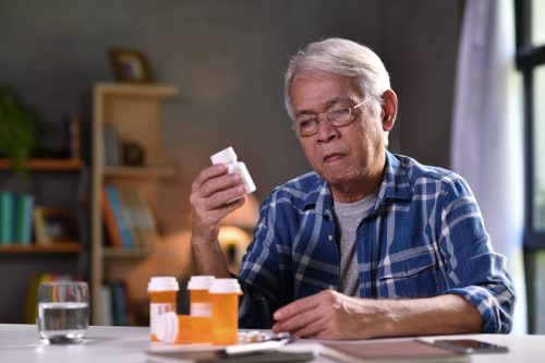 senior man with his medicine bottles
