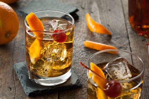 old fashioned cocktail with cherry and orange peel