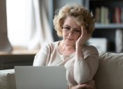 Older woman tressed on computer