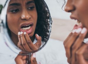 Woman looking at her teeth