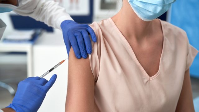 Woman getting COVID vaccine