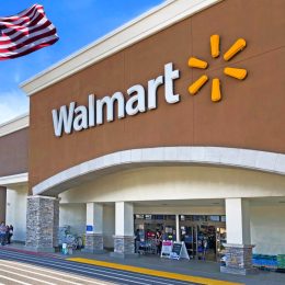 walmart exterior entrance with american flag flying nearby