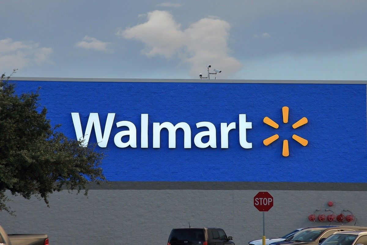 walmart store sign with sunburst logo