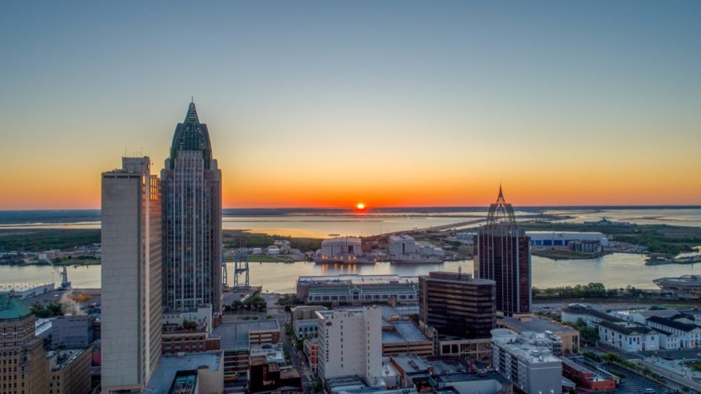 Aerial view of downtown Mobile, Alabama urban waterfront at sunrise