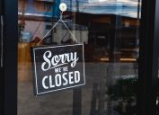 sorry we're closed sign in store window