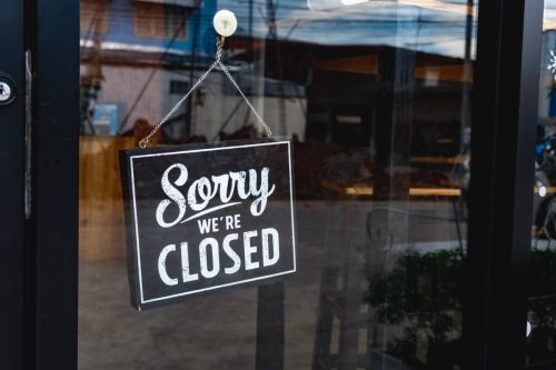 sorry we're closed sign in store window