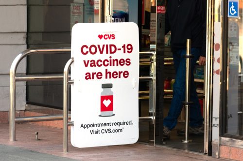 Covid-19 vaccines are here sign advertises coronavirus vaccination location at CVS Pharmacy store. - Palo Alto, California, USA - March, 2021