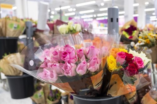 Bouquets of flowers, pink roses. Sale of flowers with a supermarket. Flower department.