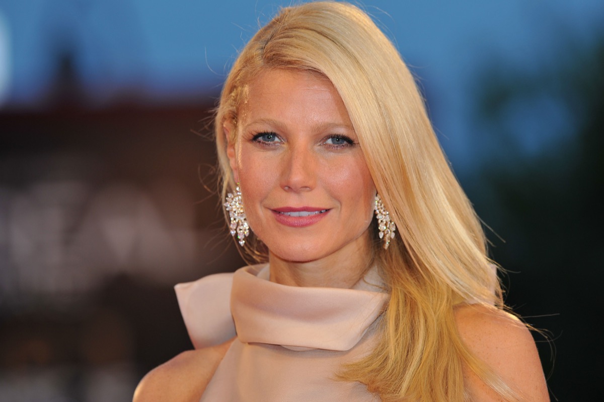 gwyneth paltrow smiles at a premiere