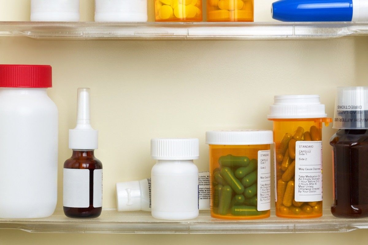 variety of medicine or supplements in cabinet